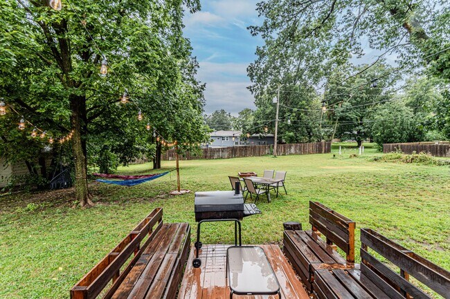 Building Photo - Back porch with a large yard!
