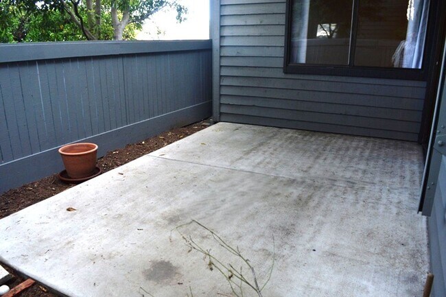 Building Photo - Spacious and Conveniently Located with Private Patio and Parking
