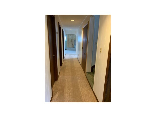 A long hallway seperates the bedroom from the living area. - 2279 Franklin St