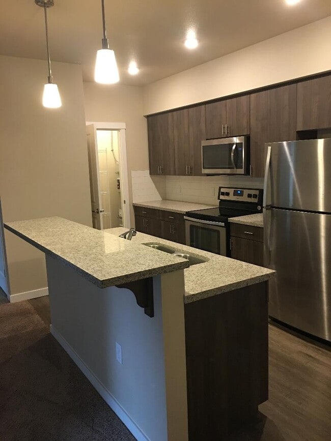 Building Photo - Stunning 1-Bedroom with Upscale Interiors & Open Island Kitchen!