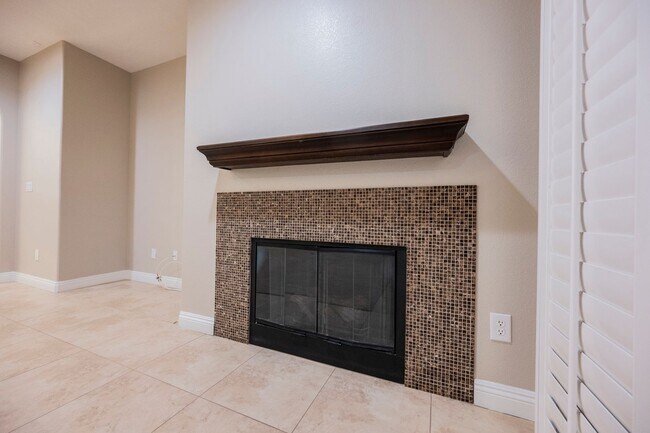 Building Photo - Single Story w/ duel primary suites gated ...