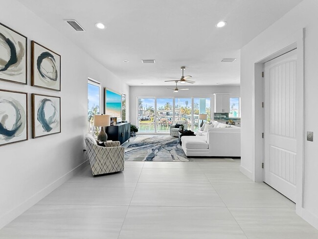 Building Photo - Waterfront Johns Pass Luxury | Steps to Beach + Pool, Hot Tub & Dock