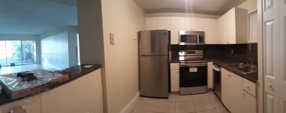 Kitchen and living room before upgrade - 4215 N University Dr