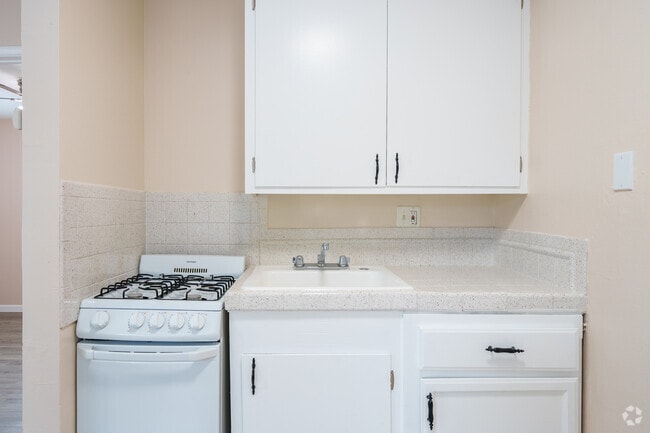 1BR, 1BA - 400SF with white counter top - Kitchen - Sandpiper Apartments
