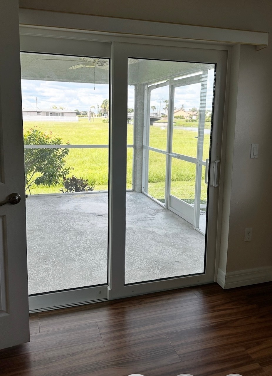 Lanai with impact windows over looks large back yard and canal - 190 Boundary Blvd