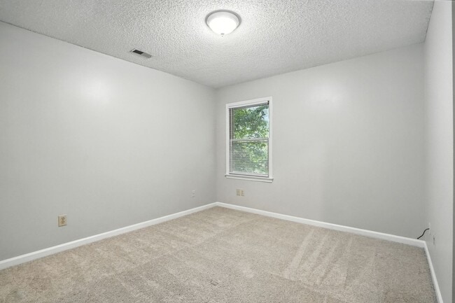 Building Photo - Spacious 2-Bedroom, 2.5-Bath End-Unit Town...
