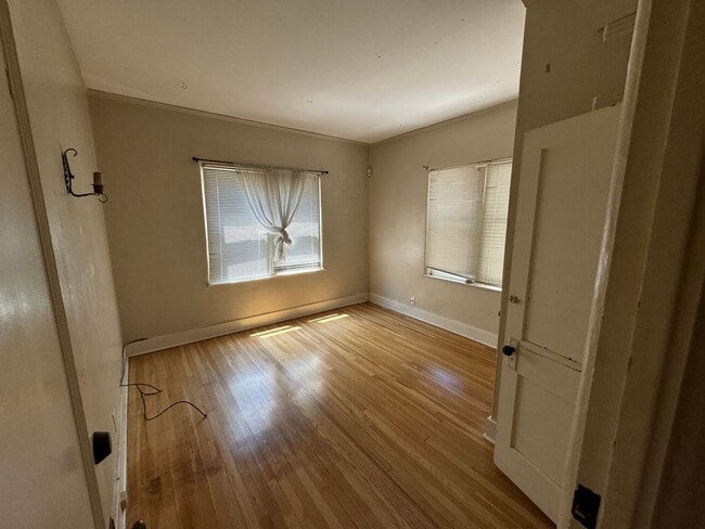 Building Photo - 4 Br, 2 Ba with kitchen appliances and basement for added storage.