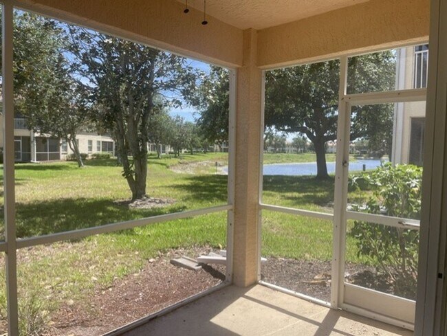 Building Photo - Elegant 3 Bedroom End-Unit Condo with Screened Lanai & Pond Views and A Private Garage