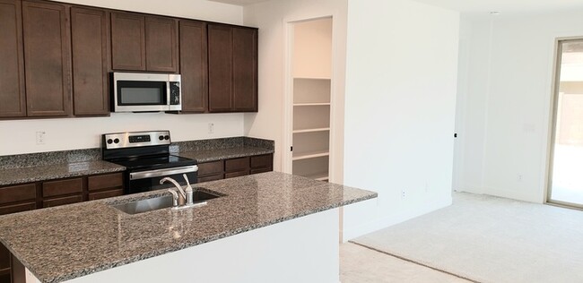 Building Photo - The 2 YEARS NEW 4 bedroom + 3 car garage r...
