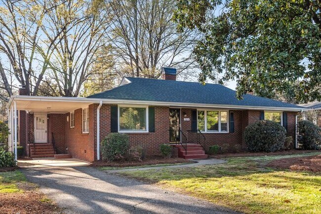 Building Photo - NW - Large Brick Ranch, Updated, Hardwoods, LR, DR, Den, Two Decorative Fire Places, Fenced, Stor...