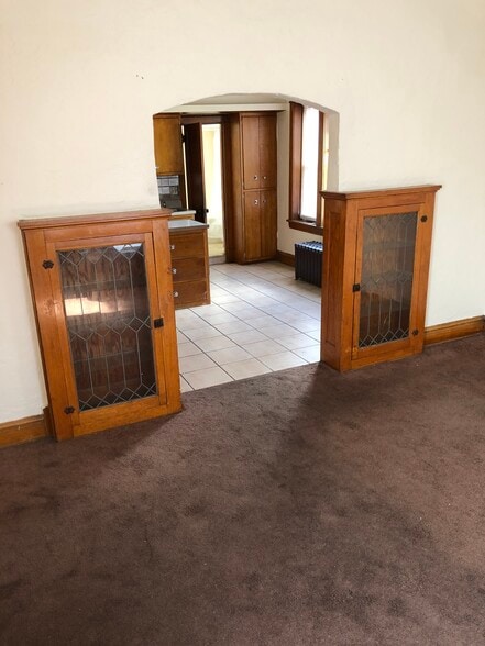Built-in storage and cabinetry with stained glass - 2346 122nd St