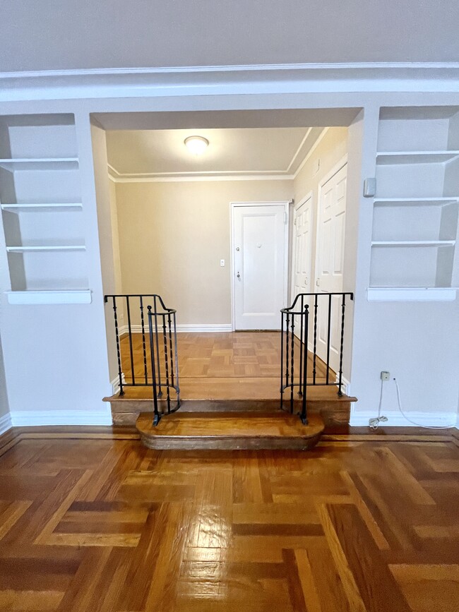 Sunken living area steps up to entrance with wrought iron railing - 210 Martine Ave