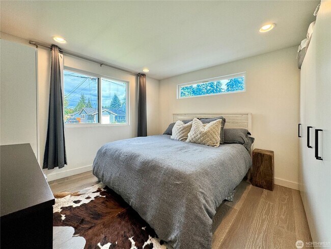 Building Photo - Remodeled 3 bdrm home on a large lot with 500 sq ft wrap around deck!