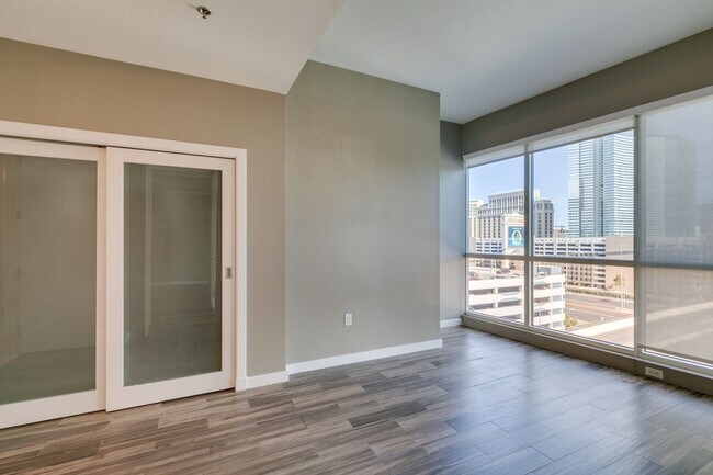 Building Photo - Iconic Strip-View Luxury | Elegant 1BR + Den High-Rise Residence