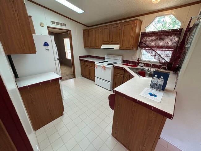 Building Photo - 3 Bed 2 Bath Mobile Home with Fenced Yard and Storage Shed
