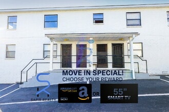 Building Photo - Move in before December 31st and choose your reward: a $250 Amazon Gift Card or a 55" Smart TV!