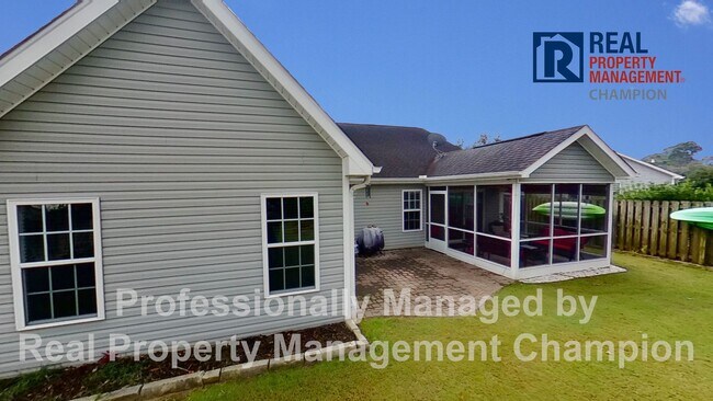 Building Photo - Beautiful home boasts open floorplan, screened porch, and spacious fenced yard