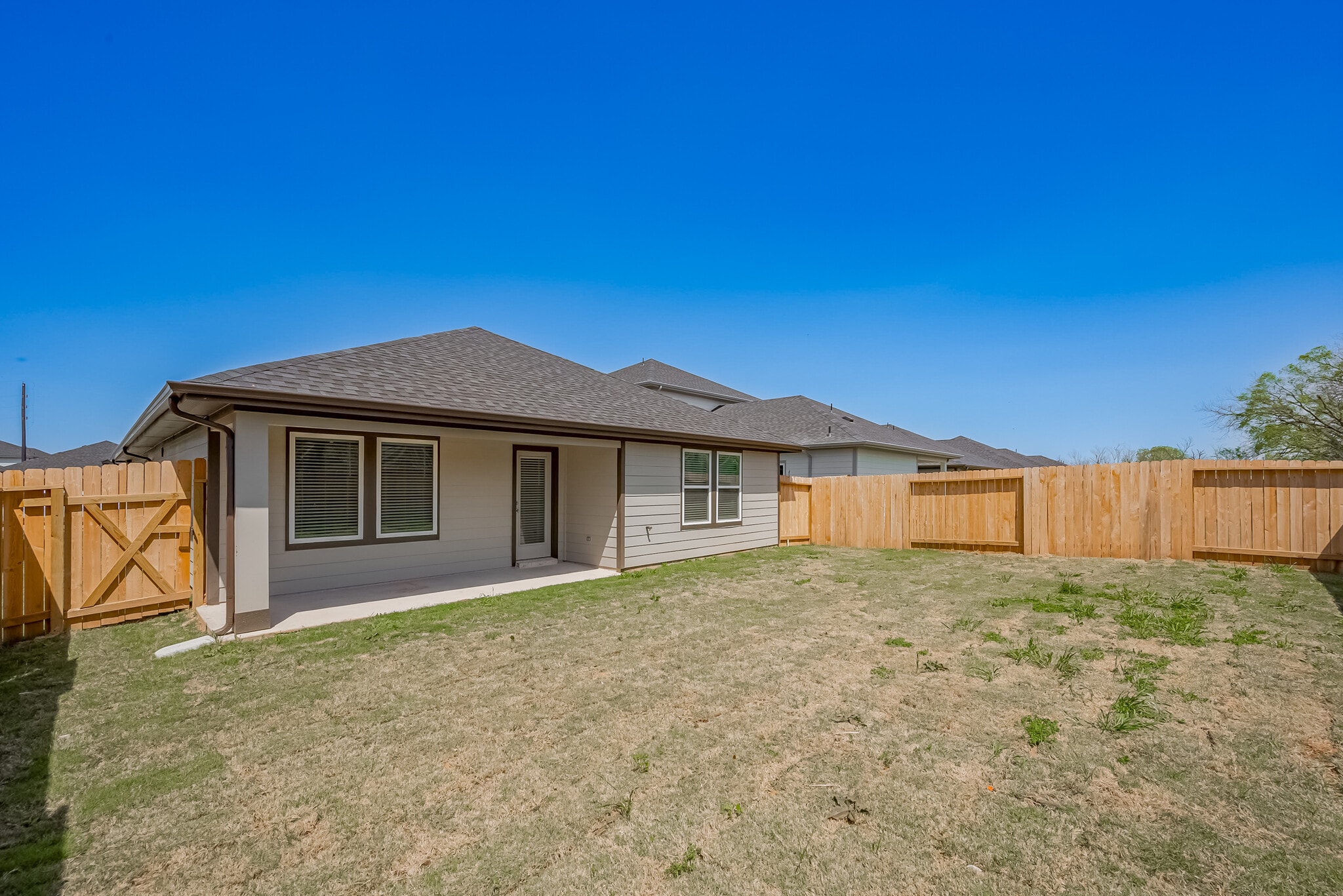 backyard features a covered patio and fully fenced yard with no backyard neighbors - 1535 Merulana Ln