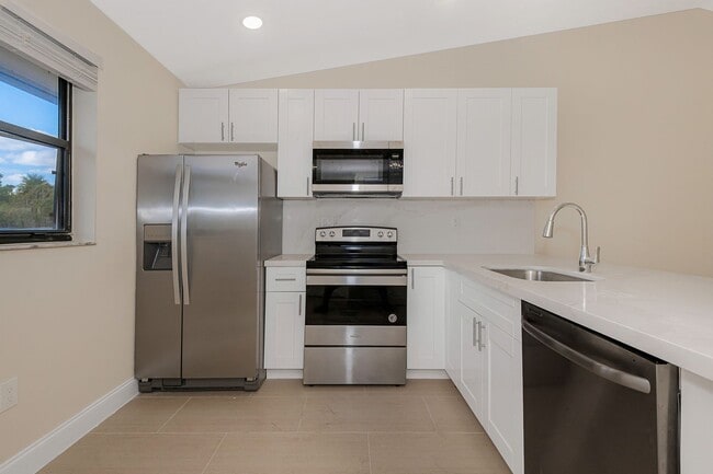 Building Photo - Fully Renovated Corner 1/1 “Villa” with Ba...