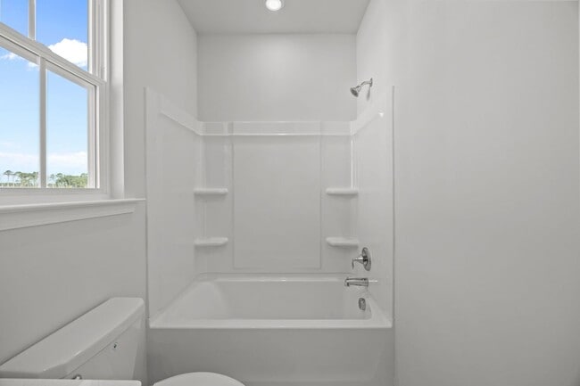 Building Photo - This brand-new home makes a statement from the moment you arrive!