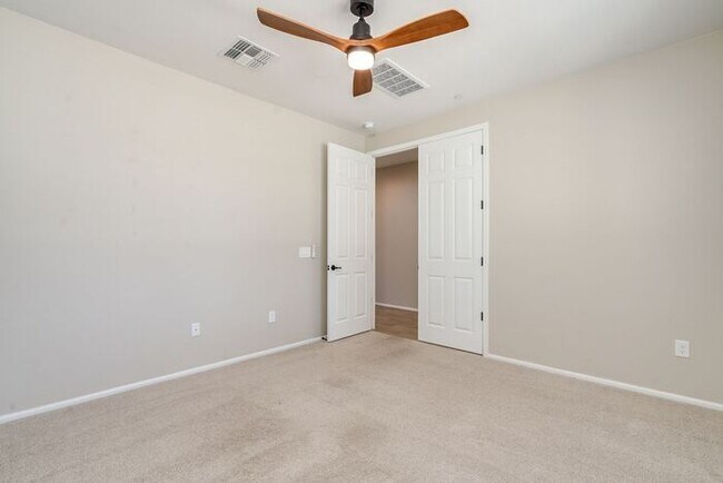 Building Photo - Amazing 4BR 2.5BA Home w/ 3-Car Tandem Garage • Pool Access • Yard w/ Fire Pit in Saguaro Trails