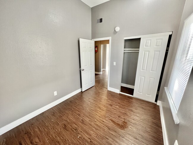 Experience comfort in this stylish bedroom with natural light and modern design features. - Williams Street