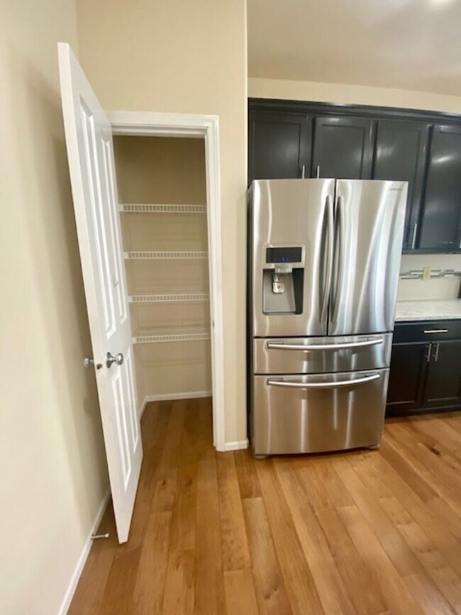 Building Photo - Beautifully Renovated 4 bedroom Home with attached 4 car garage!