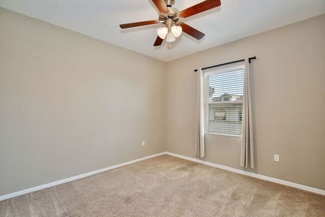 Building Photo - Gorgeous 4/2.5 Spacious Townhome with a Loft Area and a 2 Car Garage in the Desirable Gated Commu...