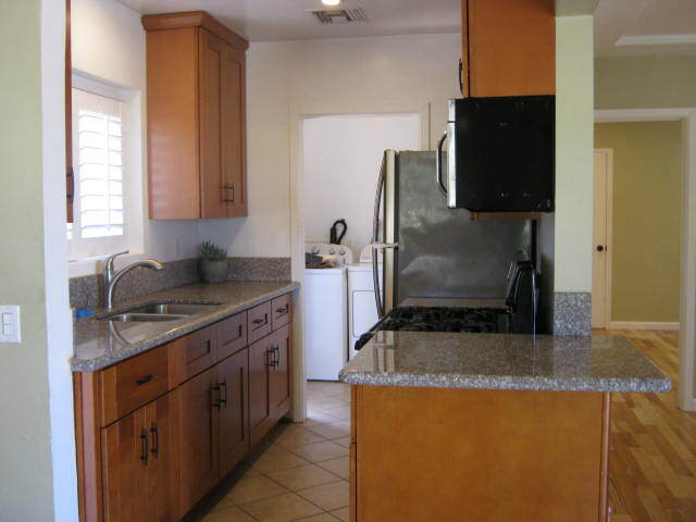 Dining room looking into kitchen and laundry - 931 S Oak St