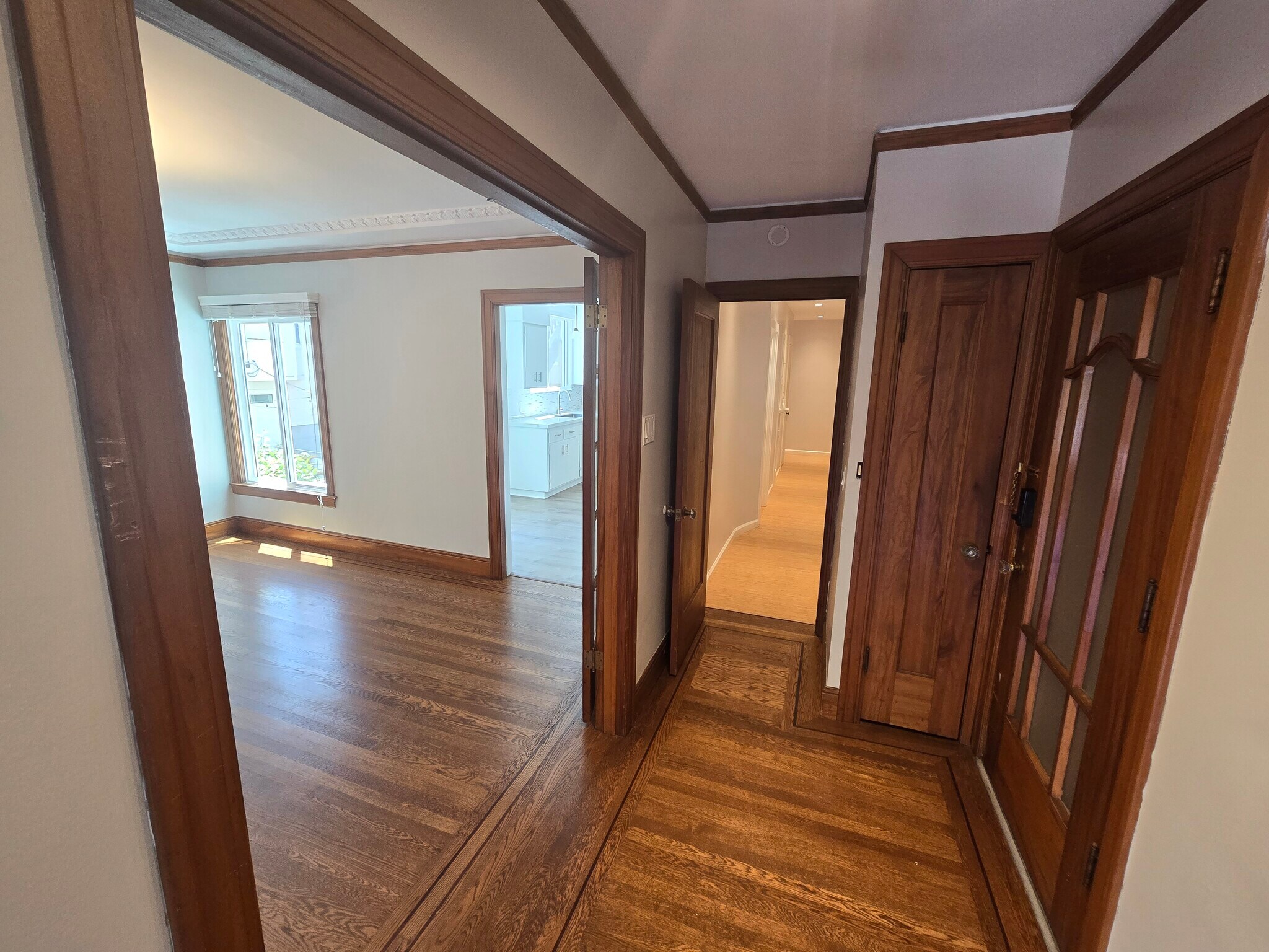 Entryway with view of dining, kitchen, hallway to bedrooms - 1681 9th Ave