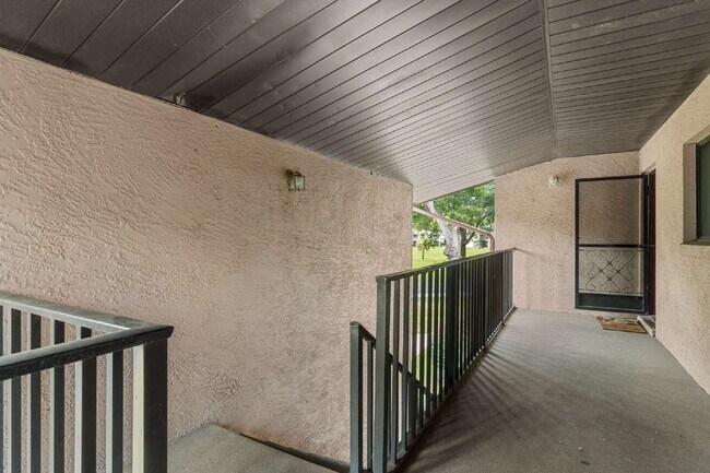 Building Photo - Freshly Updated 2BR Condo with Private Balcony, Community Pool, & In-Unit Laundry