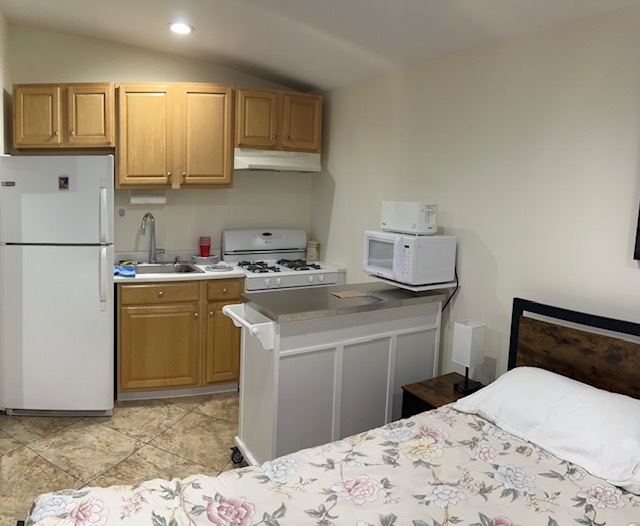 Kitchen includs toaster, microwave, refrigerator range and more - 741 W Dryden St