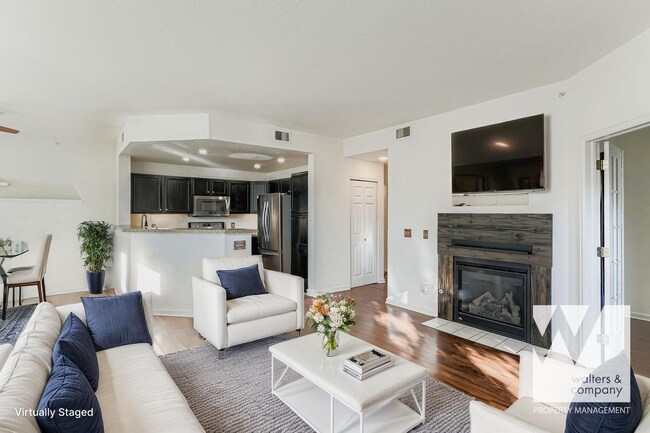 Building Photo - Light-Filled Corner Condo with Garage + Reserved Parking in Gated Community