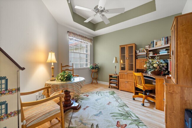 Building Photo - Experience Bell Tower Park. GATED ground floor 2 Bed 2 Bath Den 1 Car Garage Condo.