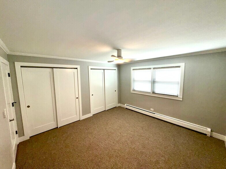 Primary bedroom with 2 full closets, all new doors, new blinds & new carpet. - 771 56th St