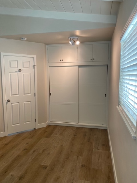 Larger bedroom: view facing closet & entry door - 210 30th St