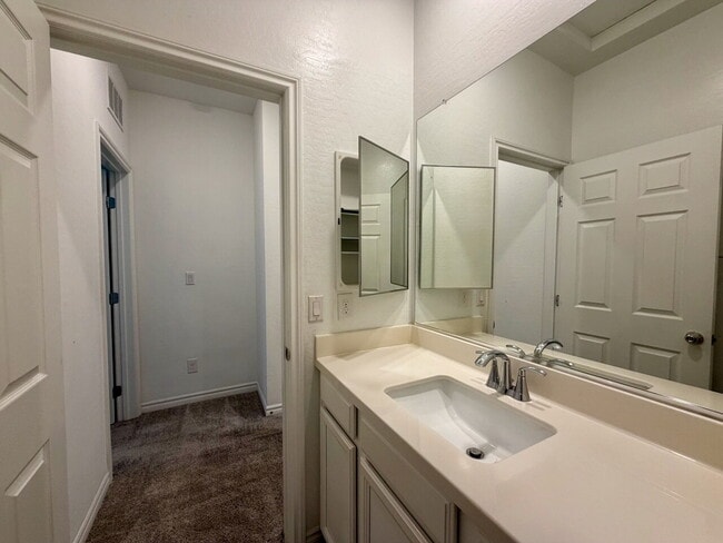 Building Photo - GATED 3 BED 2.5 BATH TOWNHOME WITH 2-CAR GARAGE, COVERED PATIO & COMMUNITY POOL