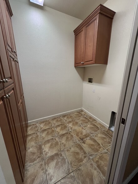 Inside laundry room - 5909 Silveroak Cir