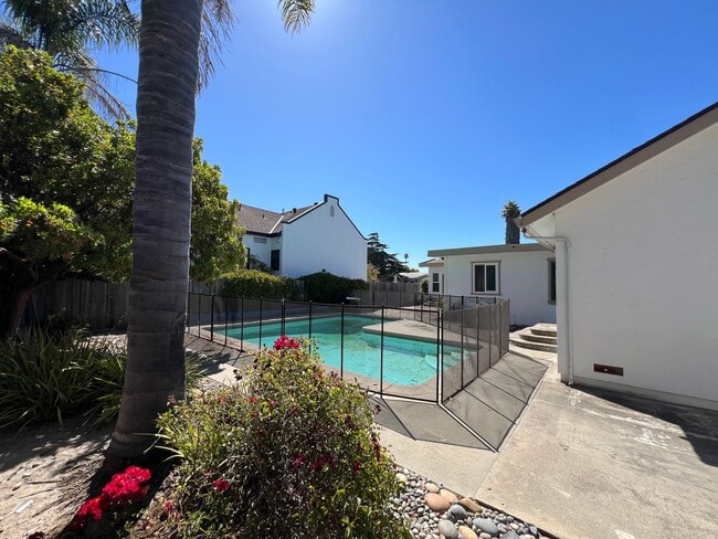 Building Photo - Spacious 4-Bedroom Retreat Just Steps from...