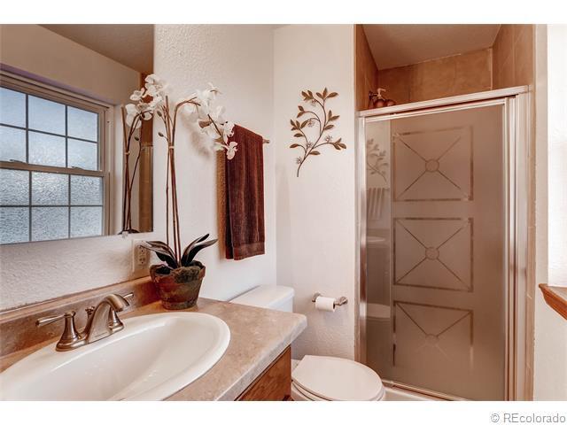 en-suite bath room with nicely tiled shower - 7091 Beech Street