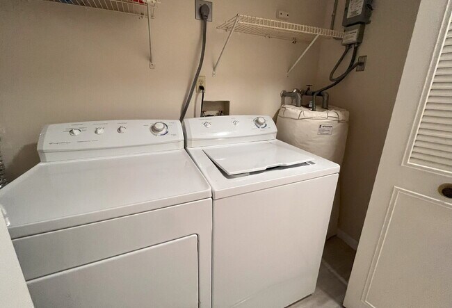 Building Photo - Two-story condominium, featuring 2 bedrooms and 2 1/2 bathrooms