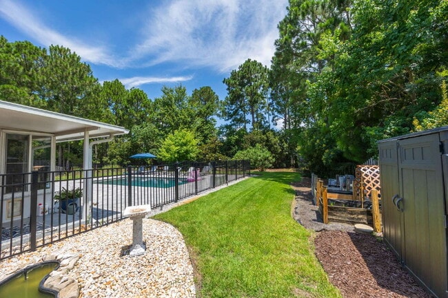 Building Photo - "Coastal Elegance Awaits: Spacious 4-Bed Oasis with $400.00 Off First Full Months Rent!"