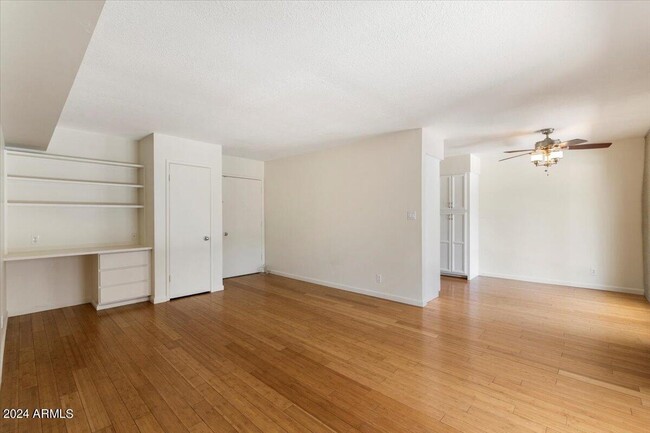 Living Room with Built in Workstation and Closet - 6935 E 4th St