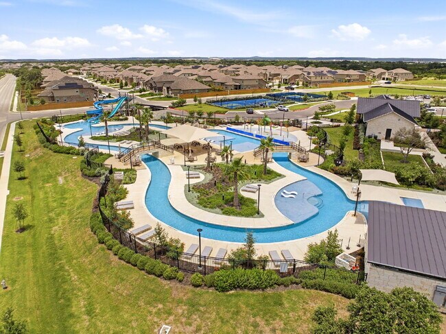 Building Photo - RESORT STYLE AMENITIES!! Multiple Pools. Lazy River. Splash Pad and Water Slides. Fitness Center....