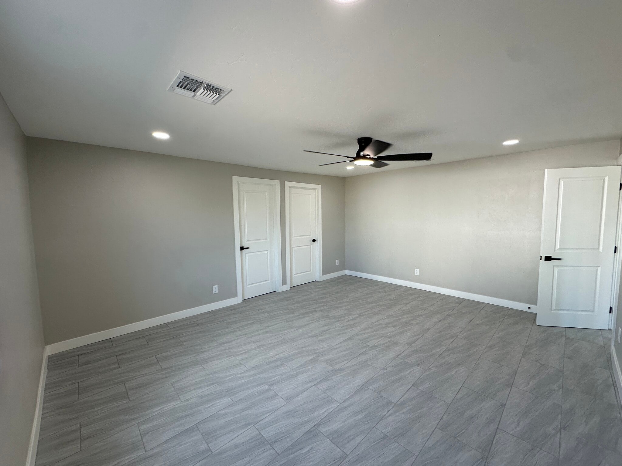 Master bedroom with walk-in closet and master bathroom. - 1331 W Speedway Blvd