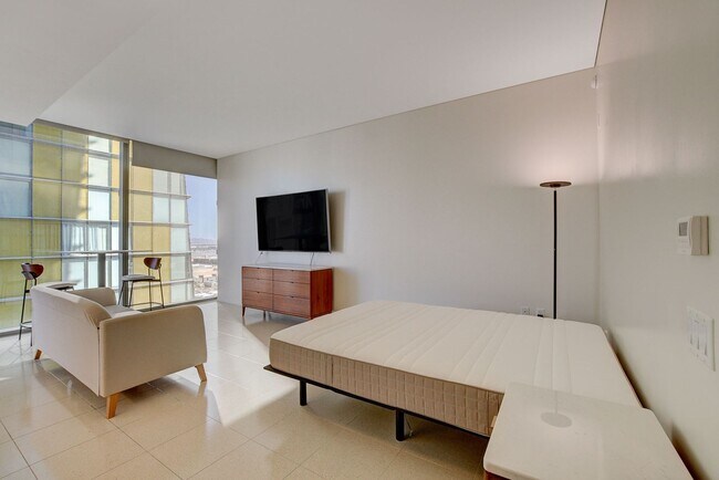 Building Photo - Stunning Strip Views from this Fully Furnished Studio Residence.