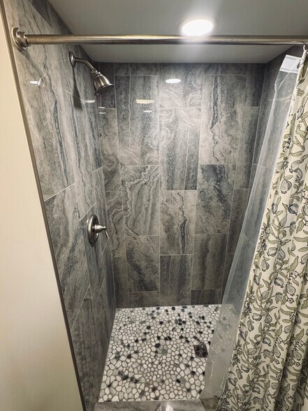 Separate walk-in shower located in wet room area. - 11116 Kensington Ave