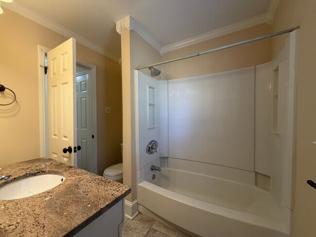 Building Photo - Freshly Painted Split-Level Home with Large Deck & Lawn Care Included