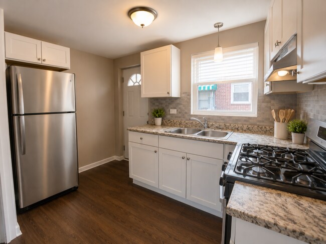 Building Photo - 8137 S Colfax Ave