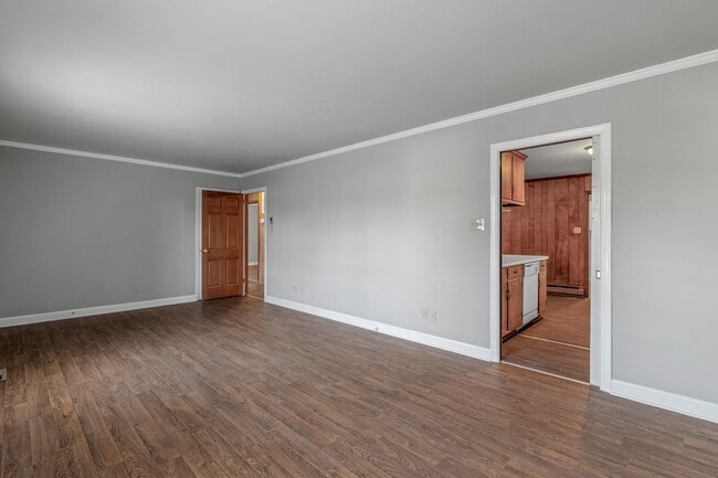 Building Photo - Large Brick Ranch, New Wood Like Flooring Throughout, Just Painted, LR, Den, Sun Room, Carport!